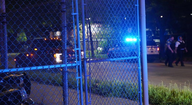 Chicago police gather at the intersection of Western Avenue and Fulton Street, where a police vehicle was rear-ended June 25, 2019. Chicago police gather at the intersection of Western Avenue and Fulton Street, where a police vehicle was rear-ended June 25, 2019.