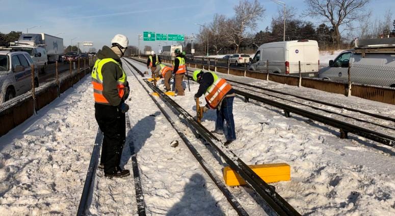 Chicago Transit Authority crews work to repair a rail malfunction that caused major delays on the Blue Line near the Forest Park station on Friday, Feb. 1, 2019.
