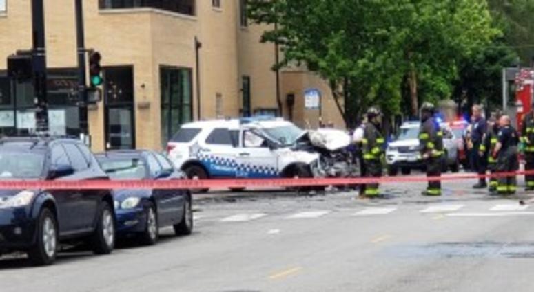 Emergency crews at the scene of a crash where a police vehicle slammed into a truck about 12:30 p.m. at the intersection of Chicago and California Avenues. Emergency crews at the scene of a crash where a police vehicle slammed into a truck about 12:30 p.m. at the intersection of Chicago and California Avenues.