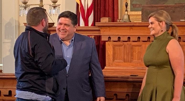 Governor-elect Pritzker and his wife M.K. greet the long line of well-wishers at the Old State Capitol in Springfield.
