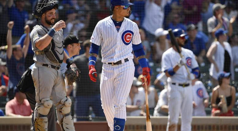 Chicago Cubs shortstop Javier Baez (9) watches his two run home run ball leave the park in front of San Diego Padres catcher Austin Hedges at Wrigley Field July 20, 2019. Chicago Cubs shortstop Javier Baez (9) watches his two run home run ball leave the park in front of San Diego Padres catcher Austin Hedges at Wrigley Field July 20, 2019.
