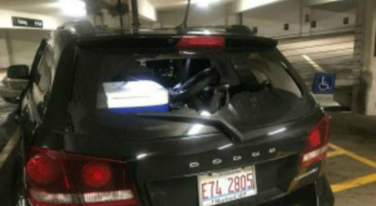 A vehicle with a broken rear windshield at a garage in the first block of East Adams Street, where 17 vehicles were damaged, Aug. 14, 2019. A vehicle with a broken rear windshield at a garage in the first block of East Adams Street, where 17 vehicles were damaged, Aug. 14, 2019.