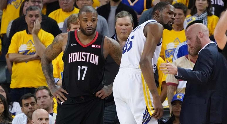 P.J. Tucker Kevin Durant P.J. Tucker of the Houston Rockets watches as Kevin Durant of the Golden State Warriors limps off with a calf injury.