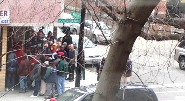 Patients line up outside Mohammed Shariff's now-shuttered Uptown medical center.