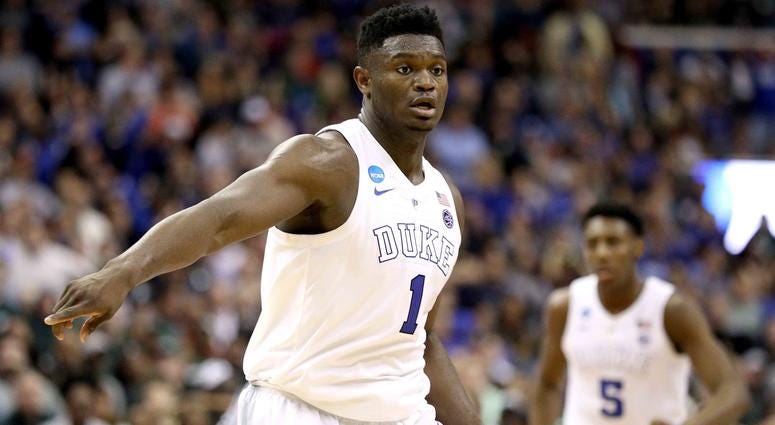 Zion Williamson Zion Williamson points on defense during a game at Duke.