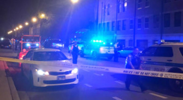 Police investigate a shooting that grazed on officer late Saturday in West Town |