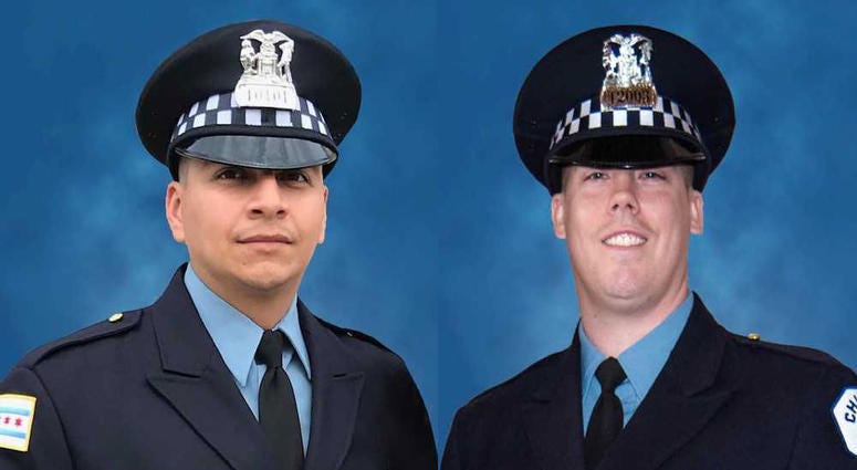 Officer Eduardo Marmolejo (left) and Officer Conrad Gary