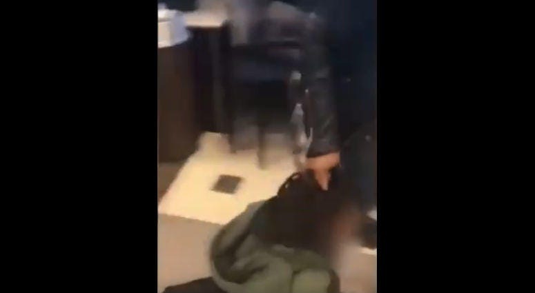 Police in Aurora are investigating a woman who was videotaped dragging a boy by his hair Monday afternoon at a hospital in the western suburb