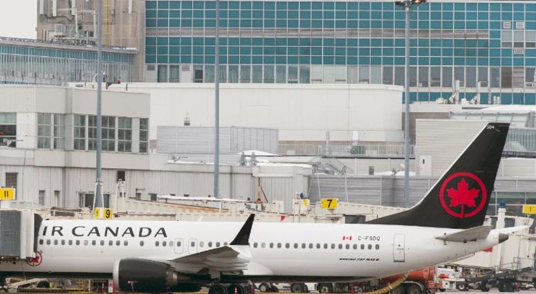 An Air Canada Boeing 737 Max 8 aircraft is parked next to a gate at Trudeau Airport in Montreal, Wednesday, March 13, 2019. Canada's transport minister says the country is closing air space to the Boeing 737 Max 8 jet following a crash An Air Canada Boeing 737 Max 8 aircraft is parked next to a gate at Trudeau Airport in Montreal, Wednesday, March 13, 2019. Canada's transport minister says the country is closing air space to the Boeing 737 Max 8 jet following a crash