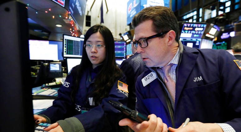 Specialist Vera Liu, left, and trader James Matthews work on the floor of the New York Stock Exchange, Wednesday, Dec. 26, 2018 Specialist Vera Liu, left, and trader James Matthews work on the floor of the New York Stock Exchange, Wednesday, Dec. 26, 2018