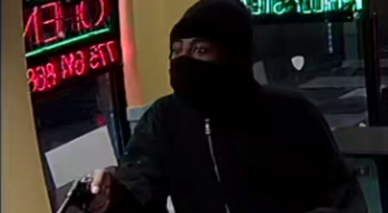 Surveillance footage of the suspect in two armed robberies this month. | Chicago police Surveillance footage of the suspect in two armed robberies this month. | Chicago police