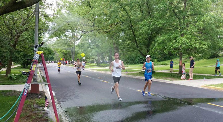 Runners get some relief from the heat at the Memorial Day Ridge Run.