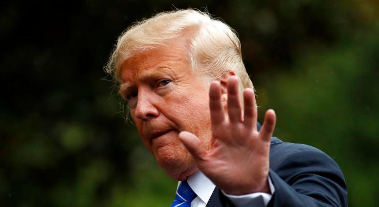 In this Tuesday, July 24, 2018, file photo, President Donald Trump waves as he walks on the South Lawn after stepping off Marine One at the White House, in Washington. In this Tuesday, July 24, 2018, file photo, President Donald Trump waves as he walks on the South Lawn after stepping off Marine One at the White House, in Washington.