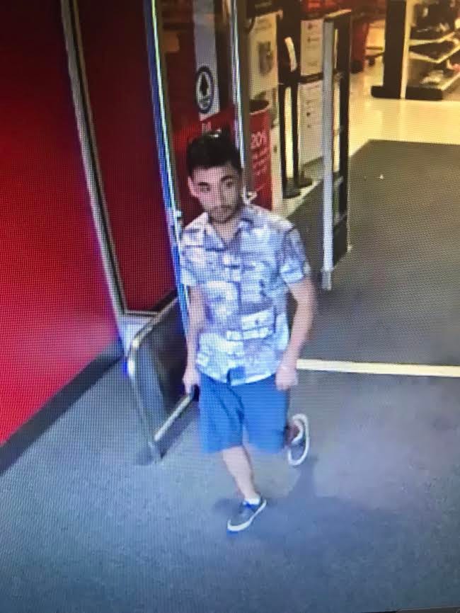 Surveillance photo of person wanted for using a stolen credit card in Downers Grove, suspected of stealing purse in Lemont