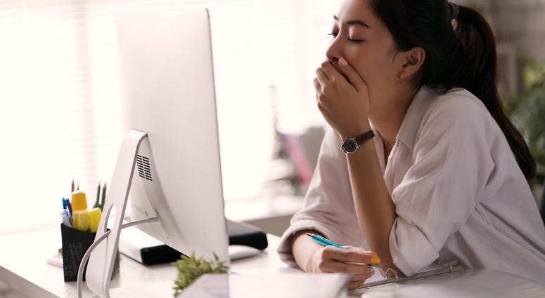 Woman yawning Workplace fatigue can be dangerous
