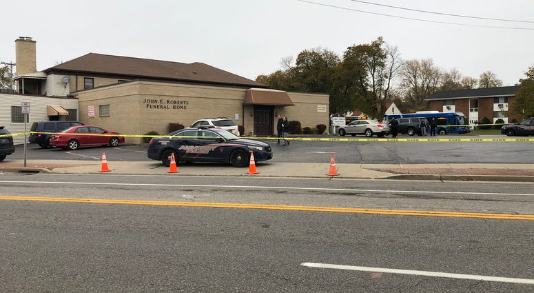 Amherst Police investigate near John E. Roberts Funeral Home on Bailey Avenue after man found unconscious Monday morning. November 4, 2019 (WBEN Photo/Mike Baggerman)