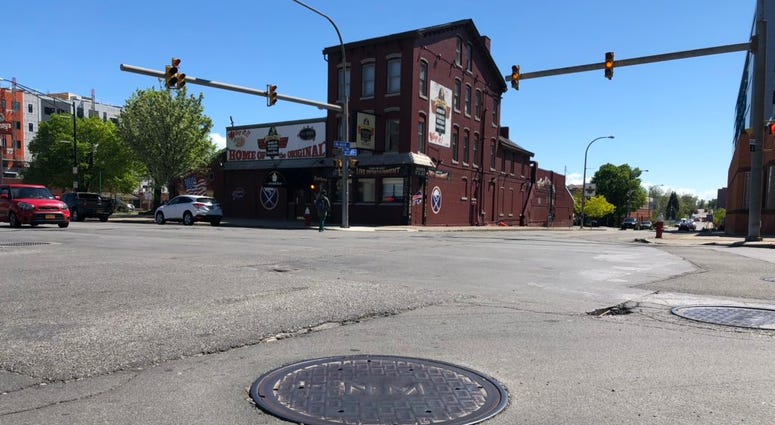 Potholes along Main Street near the Anchor Bar. May 21, 2019 (WBEN Photo/Mike Baggerman)