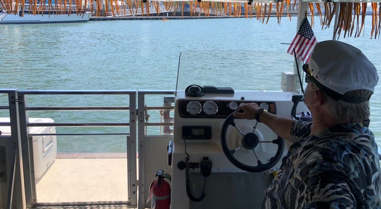 A maritime pilot on the Big Kahuna drives the boat along the Buffalo River. July 9, 2020 (WBEN Photo/Mike Baggerman) A maritime pilot on the Big Kahuna drives the boat along the Buffalo River. July 9, 2020 (WBEN Photo/Mike Baggerman)