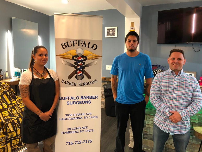 Joel Echs (right) with Aaron (center) and Lee Anne (left) at Buffalo Barber Surgeons in Hamburg. October 11, 2019 (WBEN Photo/Mike Baggerman)