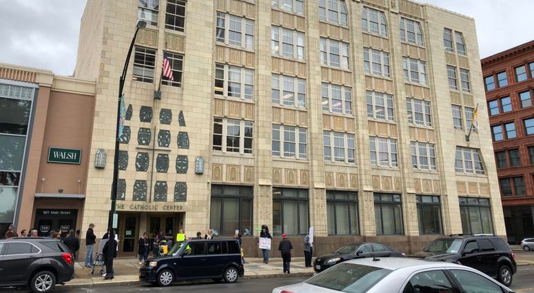 Diocese of Buffalo with two dozen protesters calling for Bishop Malone's resignation. September 10, 2018 (WBEN Photo/Mike Baggerman)