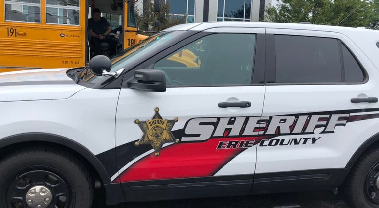 Erie County Sheriff's Office vehicle next to a school bus. August 27, 2019 (WBEN Photo/Mike Baggerman)