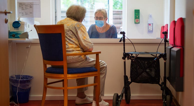 Nursing home visit/Getty Images