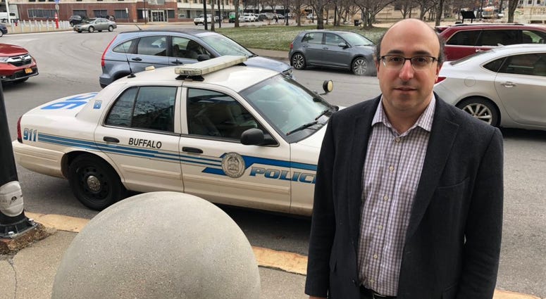 Jonathan Manes, Co-Chair of the Buffalo Police Advisory Council, standing outside Buffalo City Hall. December 4, 2018 (WBEN Photo/Mike Baggerman)