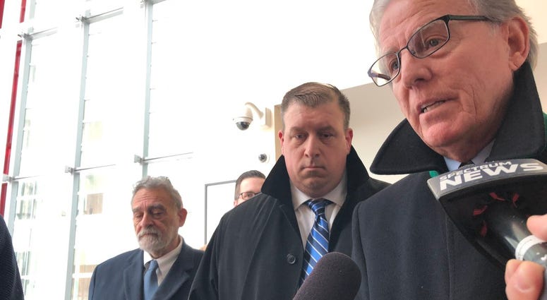 Corey Krug stands next to his attorneys Terry Connors (right) and Nicholas Romano (left) after his acquittal on two excessive force charges. February 26, 2019 (WBEN Photo/Mike Baggerman)