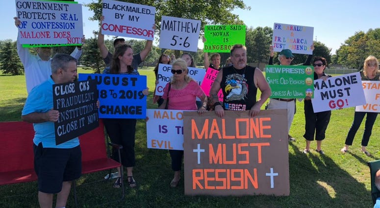 Demonstrators outside Christ the King Seminary protest and call for Bishop Malone's resignation. August 28, 2019 (WBEN Photo/Mike Baggerman)