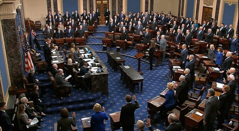 Supreme Court Chief Justice John Roberts swears in members of the Senate for the impeachment trial against President Donald Trump at the U.S. Capitol in Washington, Thursday, Jan. 16, 2020. (Senate Television via AP)