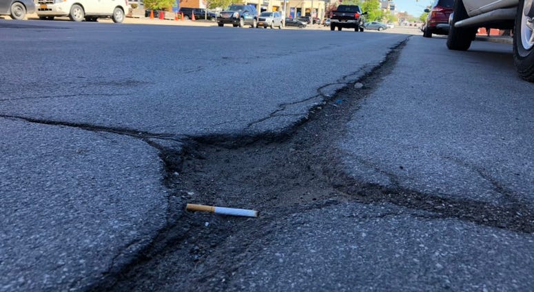 Pothole on Main Street in Buffalo. May 21, 2019 (WBEN Photo/Mike Baggerman)