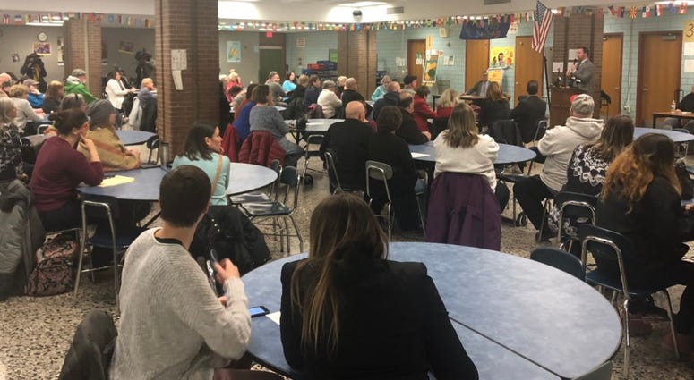 Community gathers at Southside Elementary for town meeting regarding change in law enforcement shift times.