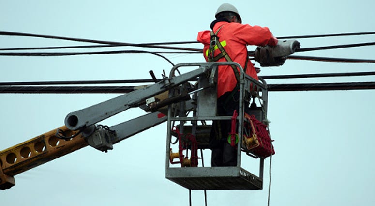 workers continue to make repairs on power lines in Northtowns