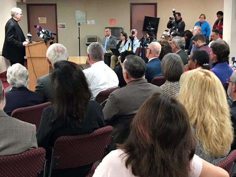 Media attends Bishop Scharfenberger press conference