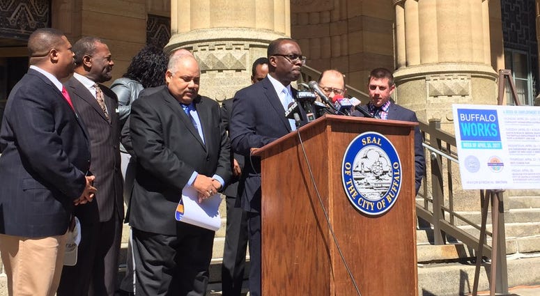 Buffalo Mayor Byron Brown and other area leaders outside City Hall on Tuesday (WBEN Photo/Mike Baggerman)