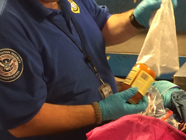 A TSA officer in Buffalo with an item that needed extra inspection (WBEN Photo/Mike Baggerman)