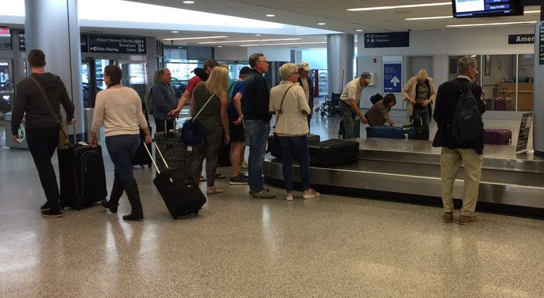 Passengers on a Buffalo-bound flight from Tampa on Friday (WBEN Photo/Mike Baggerman)