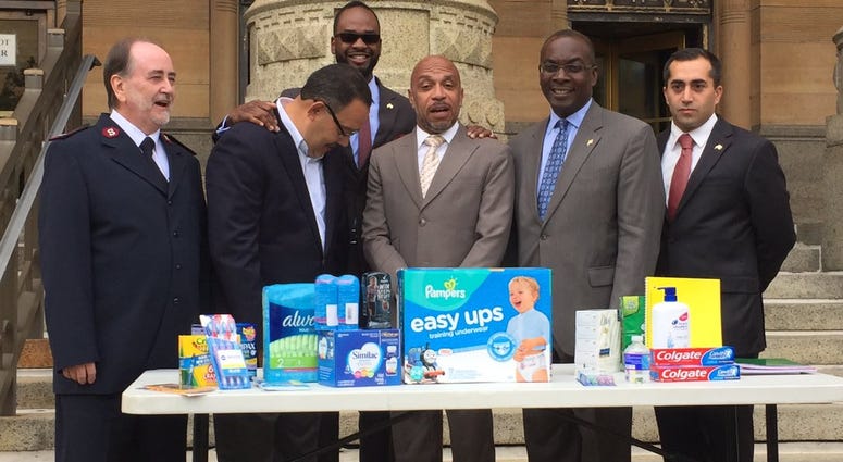 Mayor Brown and other City Officials with items sought (WBEN Photo/Mike Baggerman)