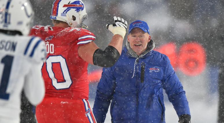 Dec 10, 2017; Orchard Park, NY, USA; Buffalo Bills head coach Sean McDermott celebrates on the field with center Eric Wood (70) following their overtime win against the Indianapolis Colts at New Era Field. Dec 10, 2017; Orchard Park, NY, USA; Buffalo Bills head coach Sean McDermott celebrates on the field with center Eric Wood (70) following their overtime win against the Indianapolis Colts at New Era Field.