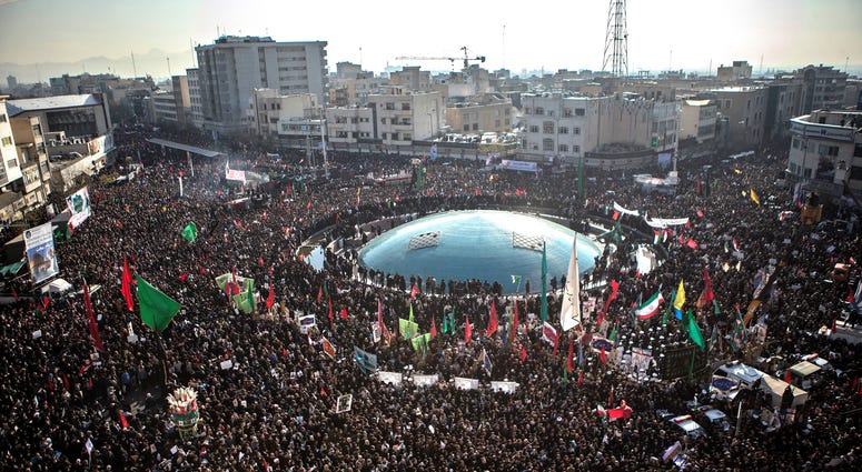 People attend the funeral ceremony of Iranian general Qassem Soleimani in Tehran