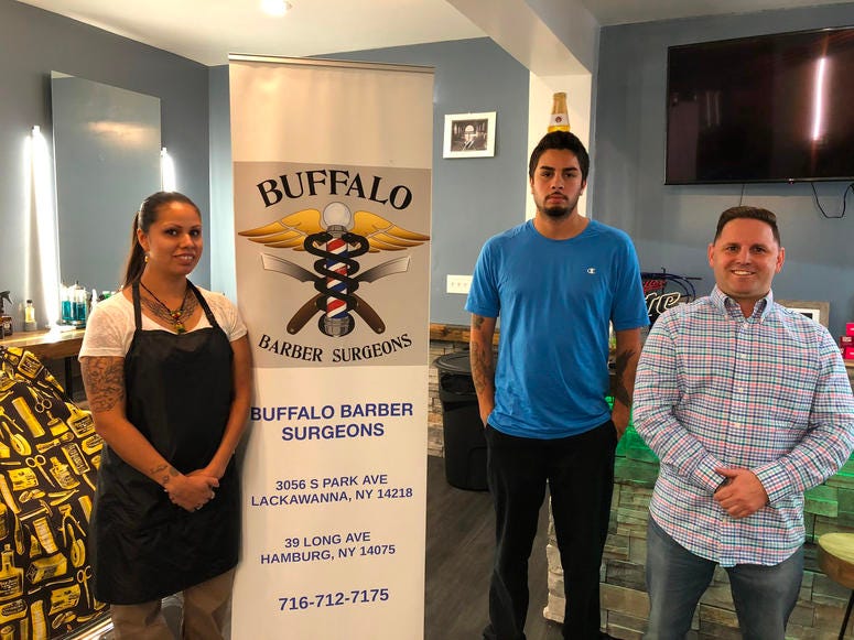 Joel Echs (right) with Aaron (center) and Lee Anne (left) at Buffalo Barber Surgeons in Hamburg. October 11, 2019 (WBEN Photo/Mike Baggerman)