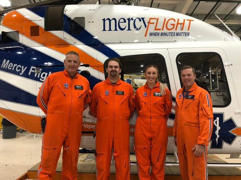 From left to right: Dennis Crandall (Chief Pilot), Daniel Hankey (Flight Paramedic), Caitlyn Sharp (Flight Nurse), and Gregg Gray (Pilot) pose in front of Mercy Flight's new Bell 429 Helicopters. November 14, 2018 (WBEN Photo/Mike Baggerman)