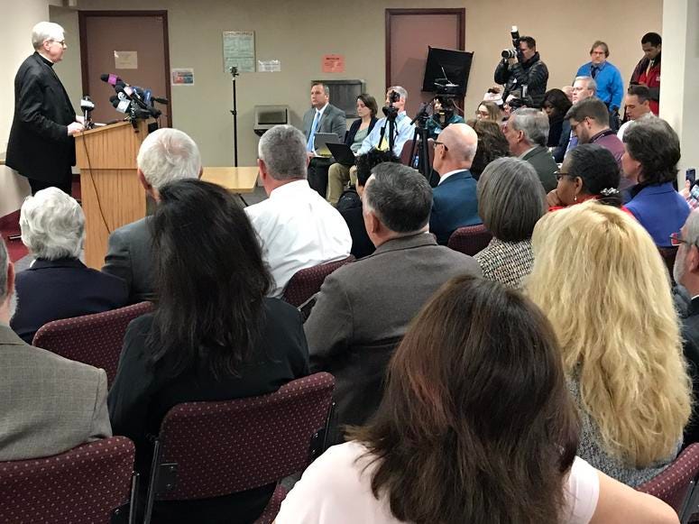 Media attends Bishop Scharfenberger press conference