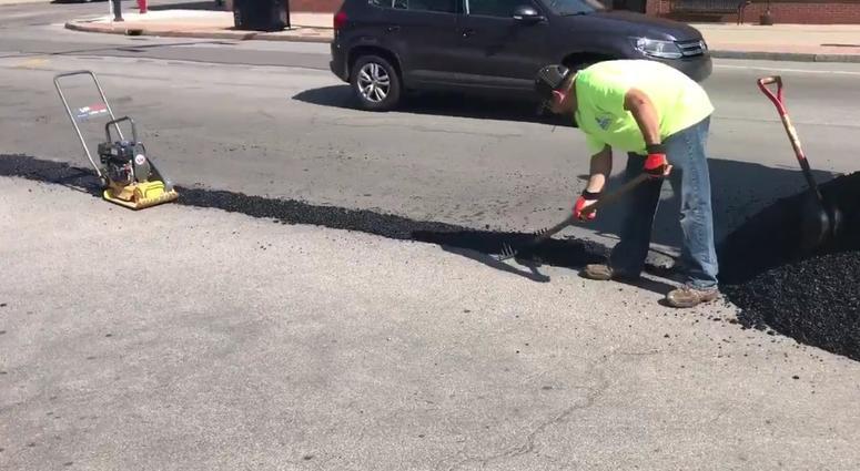 City of Buffalo DPW patching potholes. (WBEN Photo/Tim Wenger)