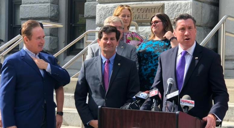 John Flynn, Mark Poloncarz, and Brian Higgins announce $900,000 federal grant to combat domestic violence. October 10, 2018 (WBEN Photo/Mike Baggerman)