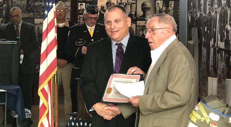 Frederick Shear (right) honored by the Buffalo & Erie County Naval & Military Park on Pearl Harbor Day. December 7, 2018 (WBEN Photo/Mike Baggerman)