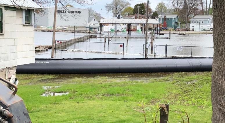 Aqua Dam placed along Lake Ontario near shoreline home. May 20, 2019 (WBEN Photo/Mike Baggerman)