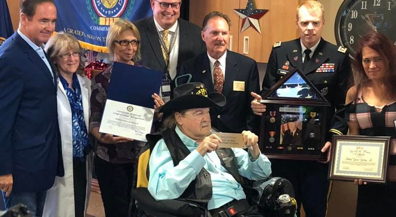 Vietnam Army Sgt. Phillip Yockey is presented with multiple awards by Congressman Brian Higgins. July 22, 2019 (WBEN Photo/Mike Baggerman)