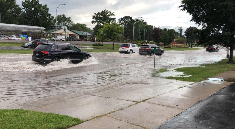 Cars pass through Sheridan Drive after the road was reopened between Colvin Boulevard and Belmont Avenue. August 21, 2019 (WBEN Photo/Mike Baggerman)