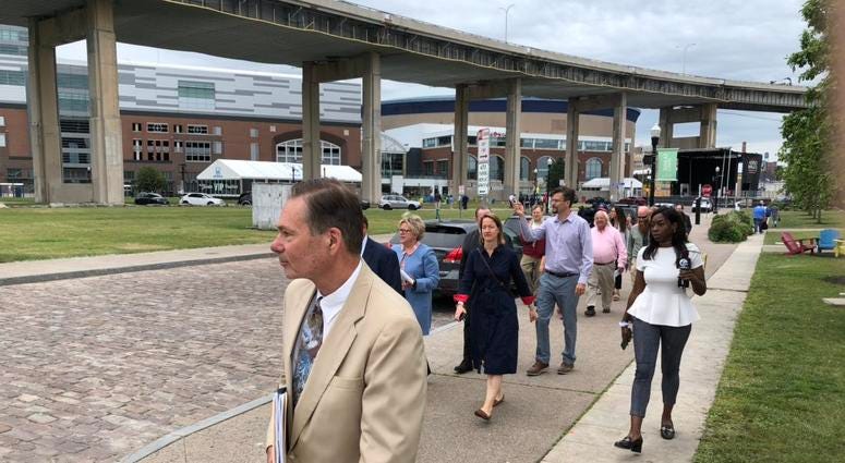 Panelists and state officials take tour of Canalside as part of Skyway corridor competition. June 24, 2019 (WBEN Photo/Mike Baggerman)